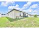 Spacious fenced backyard with a grill at 7099 Crested Orchid Dr, Brooksville, FL 34602
