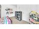 ' bedroom with a bunk bed and closet space, carpet flooring, and neutral paint at 7099 Crested Orchid Dr, Brooksville, FL 34602