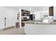 Bright kitchen with granite countertops, stainless steel appliances, and an open layout at 7099 Crested Orchid Dr, Brooksville, FL 34602