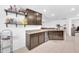 Open floor plan with modern kitchen, dining, and living areas featuring ample counter space at 7099 Crested Orchid Dr, Brooksville, FL 34602