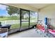 Enclosed patio that overlooks the golf course with a white picket fence at 7099 Crested Orchid Dr, Brooksville, FL 34602