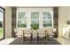 Bright dining area with a large window, modern chairs and table at 7524 E 116Th St, Palmetto, FL 34221
