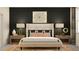 Elegantly decorated main bedroom featuring a comfortable bed, side tables, and modern artwork at 7524 E 116Th St, Palmetto, FL 34221