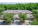 Aerial view showcasing the townhome complex with well-maintained landscaping and ample parking at 8132 Stone Path Way, Tampa, FL 33647