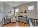 Well-lit Bedroom with hardwood floors, large windows, and coordinated furniture and decor at 8132 Stone Path Way, Tampa, FL 33647