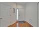 Bright foyer featuring hardwood floors, white trim, and a neutral color palette at 8132 Stone Path Way, Tampa, FL 33647