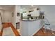 Bright kitchen featuring white cabinetry, granite countertops, and stainless steel appliances at 8132 Stone Path Way, Tampa, FL 33647