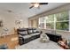 Comfortable living room with hardwood floors and plenty of natural light from a large window at 8132 Stone Path Way, Tampa, FL 33647