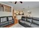 Open living room showing hardwood floors and easy access to the kitchen and dining area at 8132 Stone Path Way, Tampa, FL 33647
