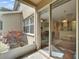 A cozy outdoor patio with a sliding glass door leading into the main living area at 8132 Stone Path Way, Tampa, FL 33647