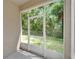 View of screened-in back porch, offering an unobstructed view of the backyard at 8132 Stone Path Way, Tampa, FL 33647