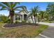 Charming one-story home with well-maintained landscaping and a three-car garage at 8208 Pinewood Run Ct, Tampa, FL 33647