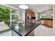 Kitchen featuring black granite island, stainless refrigerator, and stainless appliances at 8208 Pinewood Run Ct, Tampa, FL 33647