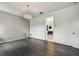Bright room with hardwood floors, a modern chandelier, and a view to the bathroom at 8208 Pinewood Run Ct, Tampa, FL 33647
