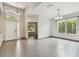 Spacious living room featuring tile floors, and windows offering plenty of natural light at 8208 Pinewood Run Ct, Tampa, FL 33647