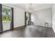Bright, spacious living room with hardwood floors and large windows at 8208 Pinewood Run Ct, Tampa, FL 33647