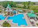 Aerial view of community pool including a waterslide, a splash pad, lap lanes, and seating areas at 8208 Pinewood Run Ct, Tampa, FL 33647