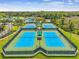 Aerial shot of well-maintained tennis courts for community residents at 8208 Pinewood Run Ct, Tampa, FL 33647