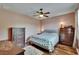 Spacious bedroom with hardwood floors, a ceiling fan, and lots of storage at 9023 Sienna Moss Ln, Riverview, FL 33578
