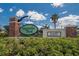Magnolia Park East community entrance sign with manicured landscaping and blue skies at 9023 Sienna Moss Ln, Riverview, FL 33578