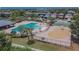 Overhead view of a community pool area, including a splash pad, pool, and seating at 9023 Sienna Moss Ln, Riverview, FL 33578