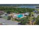 Aerial shot of community amenities: pool, splash pad, basketball court, near lake at 9023 Sienna Moss Ln, Riverview, FL 33578