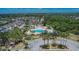 Aerial view of community pool, playground, and surrounding houses; perfect for families at 9023 Sienna Moss Ln, Riverview, FL 33578
