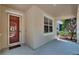 Covered front porch entrance with window at 9023 Sienna Moss Ln, Riverview, FL 33578