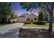 Inviting single-Gathering home featuring a well-manicured lawn and attached two-car garage at 9023 Sienna Moss Ln, Riverview, FL 33578