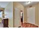 Inviting hallway with hardwood floors, closet, and front door at 9023 Sienna Moss Ln, Riverview, FL 33578