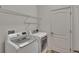The laundry room includes new LG washer and dryer units and wire shelving at 9023 Sienna Moss Ln, Riverview, FL 33578