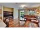 The living room has a view from the kitchen and sliding glass doors to a screened patio at 9023 Sienna Moss Ln, Riverview, FL 33578