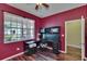 The office features a built-in desk and a large window for natural light at 9023 Sienna Moss Ln, Riverview, FL 33578