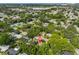 Aerial view of a quiet neighborhood with mature trees, highlighting the property's location within a well-established area at 913 Chester Dr, Clearwater, FL 33756