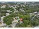 Aerial view of a charming neighborhood with lush trees, showcasing the home's location within a beautiful community at 913 Chester Dr, Clearwater, FL 33756