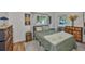 Comfortable bedroom featuring a cozy bed, stylish furnishings, and natural light from windows at 913 Chester Dr, Clearwater, FL 33756