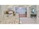 Updated kitchen featuring granite countertops, white cabinetry, stainless steel appliances, and an adjacent dining area at 913 Chester Dr, Clearwater, FL 33756