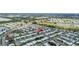 An aerial view showcases an idyllic neighborhood featuring well-kept homes, serene ponds, and lush green spaces in a vibrant community at 9743 36Th N Way # 4, Pinellas Park, FL 33782