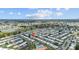 Panoramic aerial view shows a community with beautiful lakes, a golf course, and a recreation center with a pool, promoting an active lifestyle at 9743 36Th N Way # 4, Pinellas Park, FL 33782