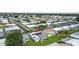 Aerial view of a neighborhood featuring well-maintained homes, landscaping, and a sunny atmosphere at 9743 36Th N Way # 4, Pinellas Park, FL 33782