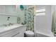 Compact bathroom featuring a shower, vanity, and a decorative wall clock at 9743 36Th N Way # 4, Pinellas Park, FL 33782