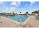 A view of the community pool and surrounding deck, providing residents a relaxing area to enjoy a refreshing swim at 9743 36Th N Way # 4, Pinellas Park, FL 33782