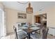 Dining room featuring a woven pendant light and coastal decor at 9743 36Th N Way # 4, Pinellas Park, FL 33782