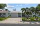 Charming single-story home with a manicured lawn, beautiful driveway, and inviting curb appeal at 9743 36Th N Way # 4, Pinellas Park, FL 33782