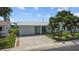 Charming single-story home with a manicured lawn, beautiful driveway, and inviting curb appeal at 9743 36Th N Way # 4, Pinellas Park, FL 33782