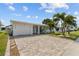 Charming single-story home with a well-manicured lawn, beautiful driveway, and inviting curb appeal at 9743 36Th N Way # 4, Pinellas Park, FL 33782