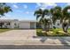 Charming single-story home with beautiful landscaping and a brick driveway at 9743 36Th N Way # 4, Pinellas Park, FL 33782