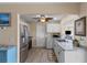 Bright kitchen features modern appliances and granite countertops at 9743 36Th N Way # 4, Pinellas Park, FL 33782