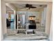 Kitchen with stainless steel appliances, granite countertops, white cabinets, and open floor plan view at 9743 36Th N Way # 4, Pinellas Park, FL 33782