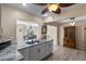 Open concept kitchen with granite counters and a view to the dining area at 9743 36Th N Way # 4, Pinellas Park, FL 33782